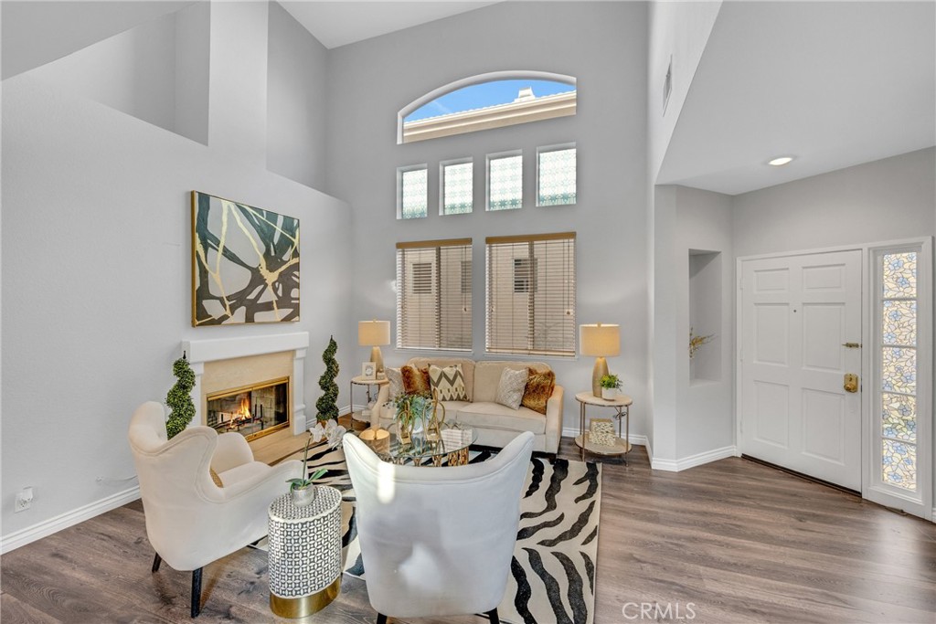 738 Orchard Loop Azusa, CA 91702 - Photo 4 of 50 a living room with fireplace furniture and a window