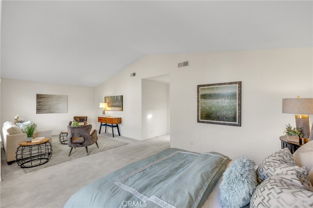 738 Orchard Loop Azusa, CA 91702 - Photo 41 of 50 a bedroom with a bed and wooden floor