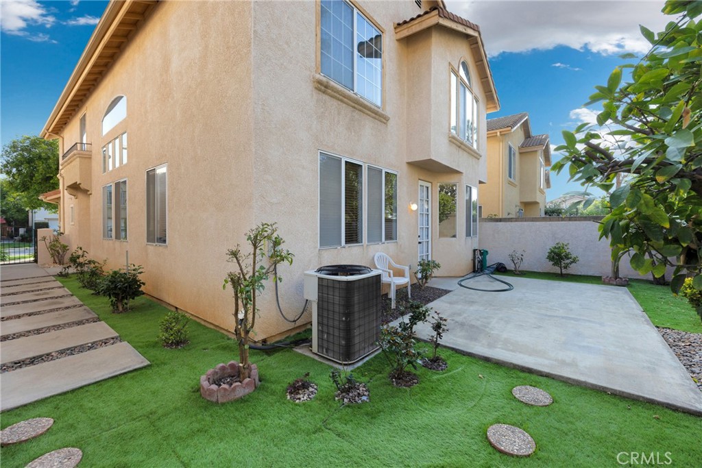738 Orchard Loop Azusa, CA 91702 - Photo 44 of 50 a view of an house with backyard space and garden
