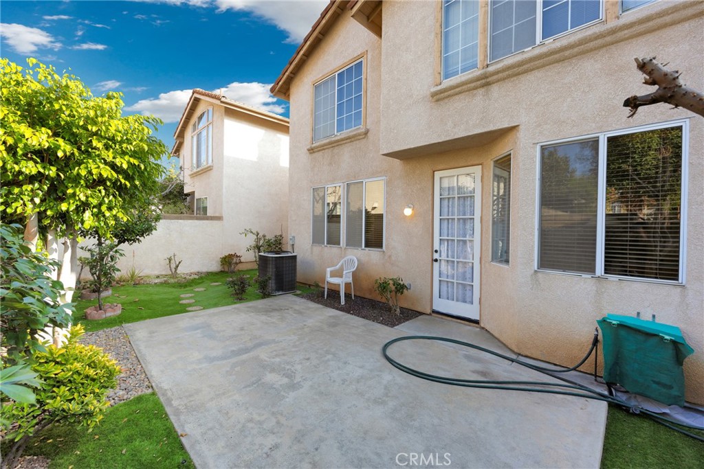 738 Orchard Loop Azusa, CA 91702 - Photo 46 of 50 a backyard of a house with table and chairs