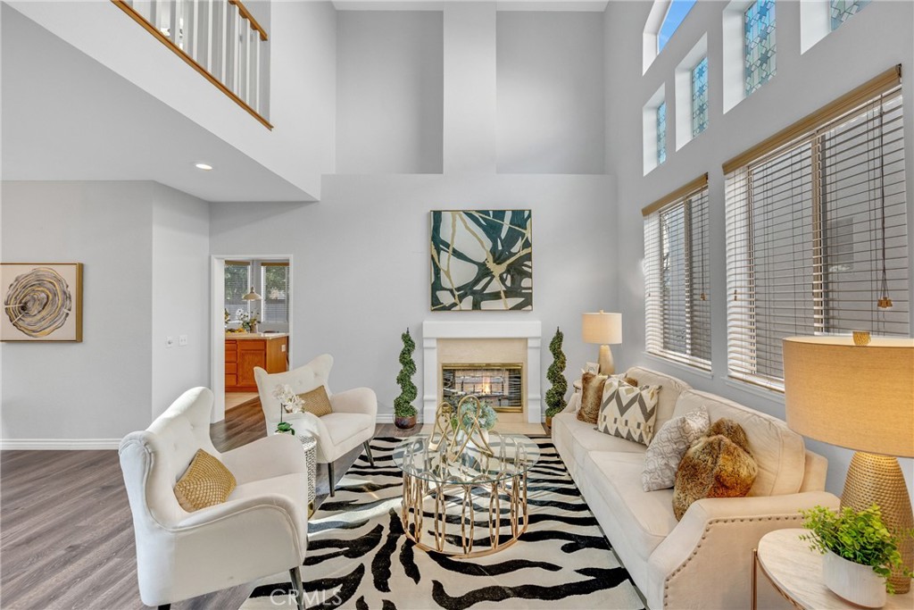 738 Orchard Loop Azusa, CA 91702 - Photo 5 of 50 a living room with furniture and a fireplace