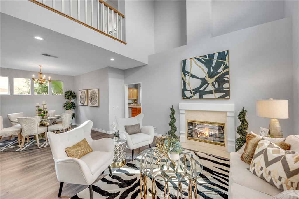 738 Orchard Loop Azusa, CA 91702 - Photo 7 of 50 a living room with furniture a rug and a fireplace