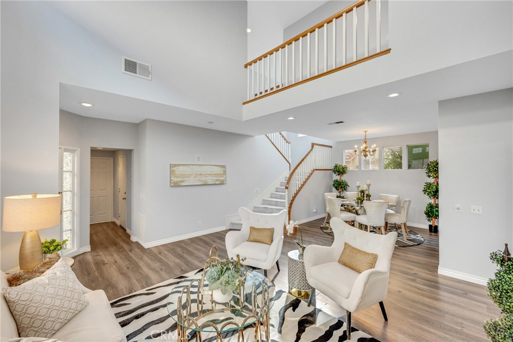 738 Orchard Loop Azusa, CA 91702 - Photo 8 of 50 a bedroom with furniture and a wooden floor