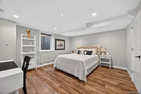 a bedroom with a bed and a chair