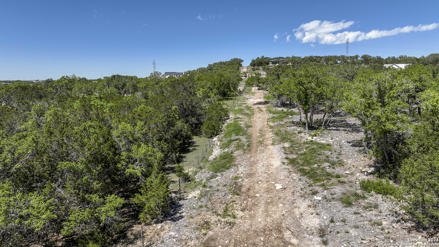 34744 Ansley Rdg Trail Bulverde, TX 78163 - Photo 22 of 39 a view of a lake in middle of forest