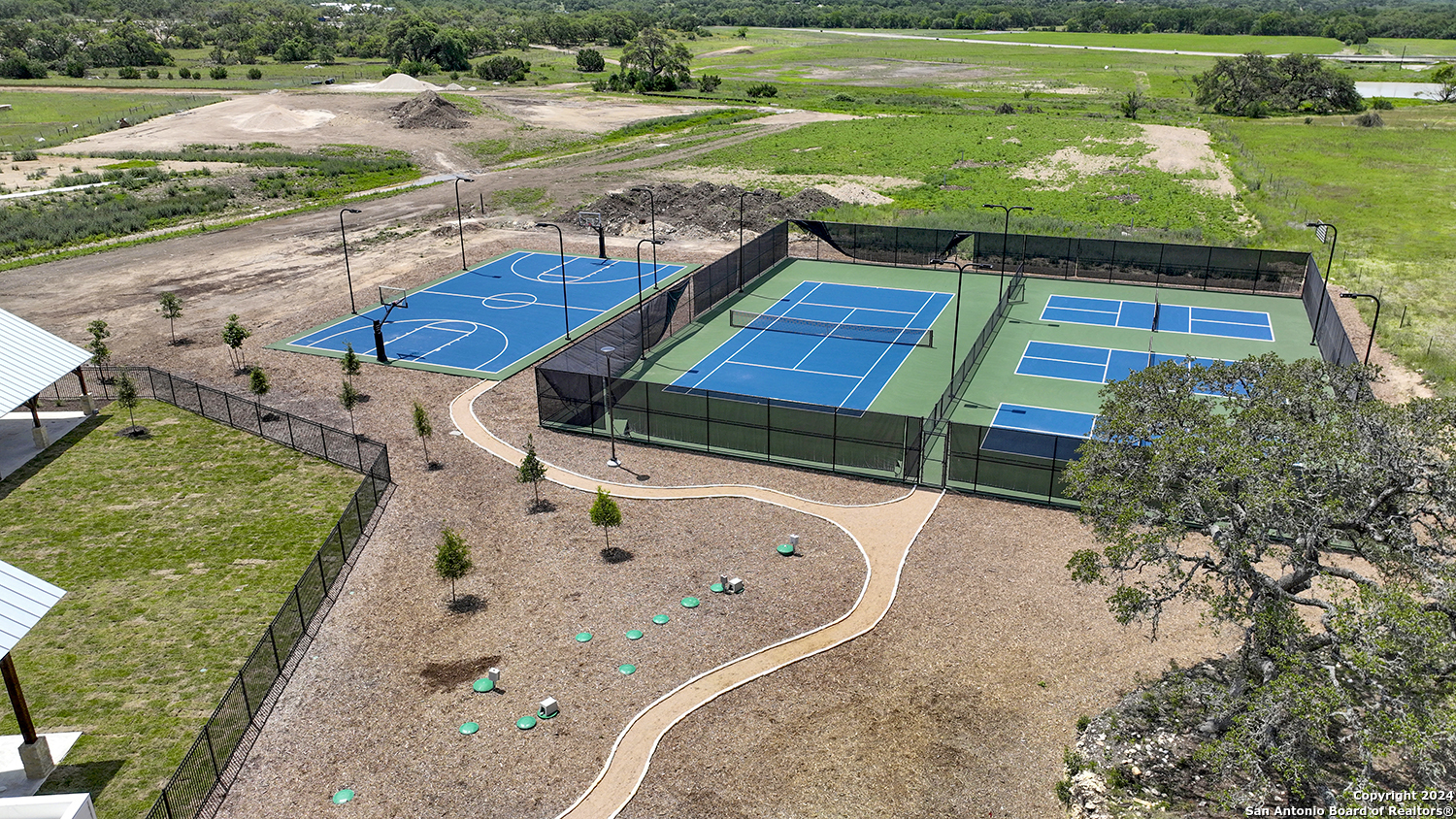 34744 Ansley Rdg Trail Bulverde, TX 78163 - Photo 34 of 39 an aerial view of a swimming pool with a yard and outdoor seating