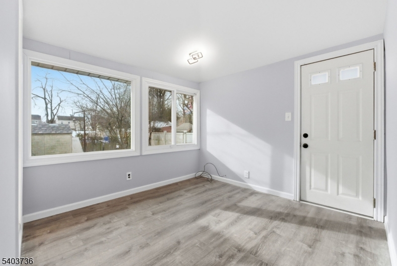 43 Freeman Street Woodbridge, NJ 07095 - Photo 11 of 24 a view of an empty room with a window