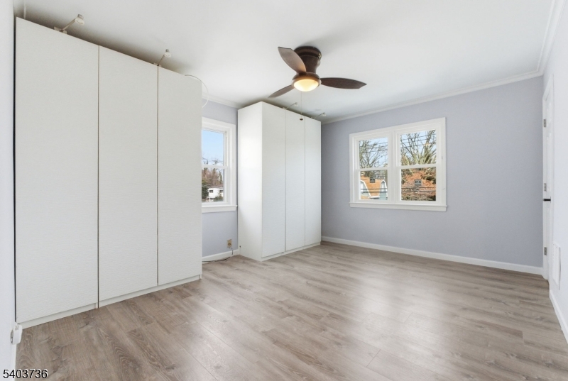 43 Freeman Street Woodbridge, NJ 07095 - Photo 15 of 24 a view of an empty room with a window and wooden floor