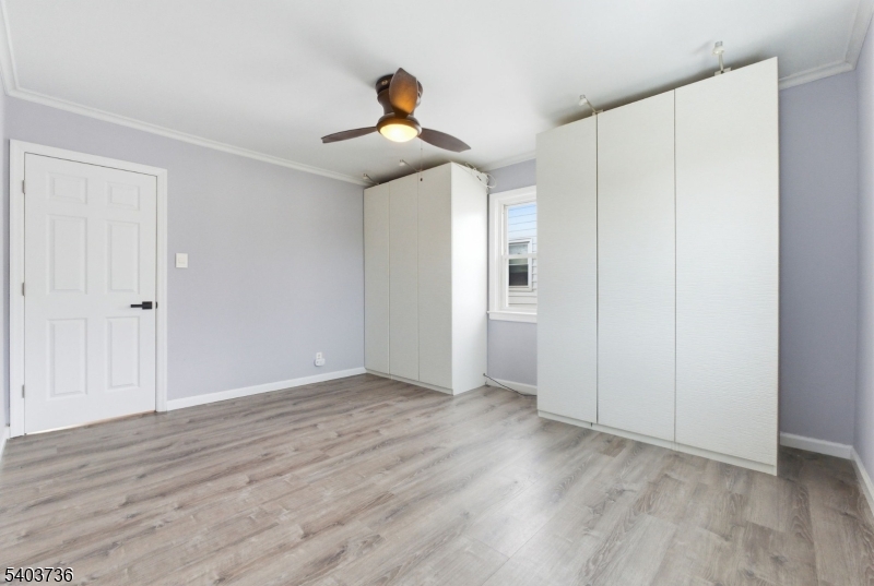 43 Freeman Street Woodbridge, NJ 07095 - Photo 16 of 24 a view of an empty room with wooden floor