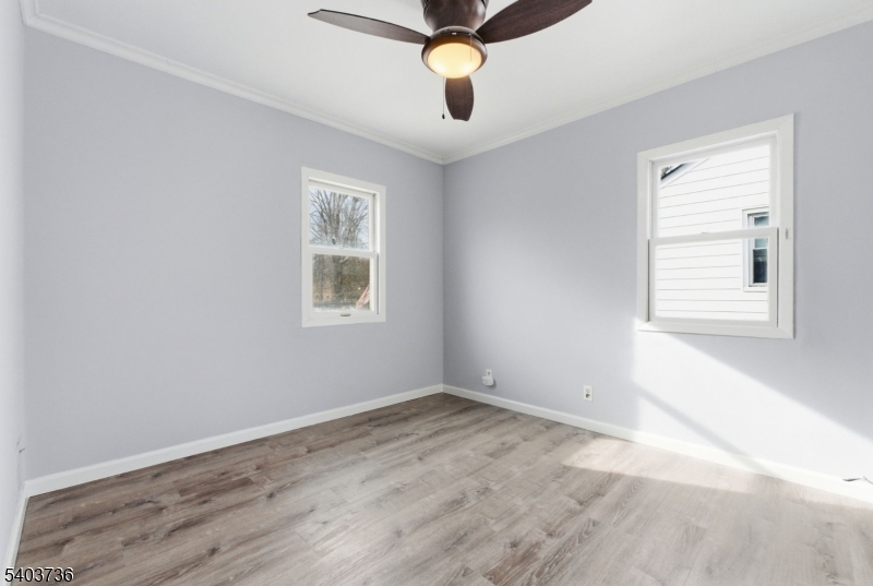 43 Freeman Street Woodbridge, NJ 07095 - Photo 17 of 24 wooden floor in an empty room with a window