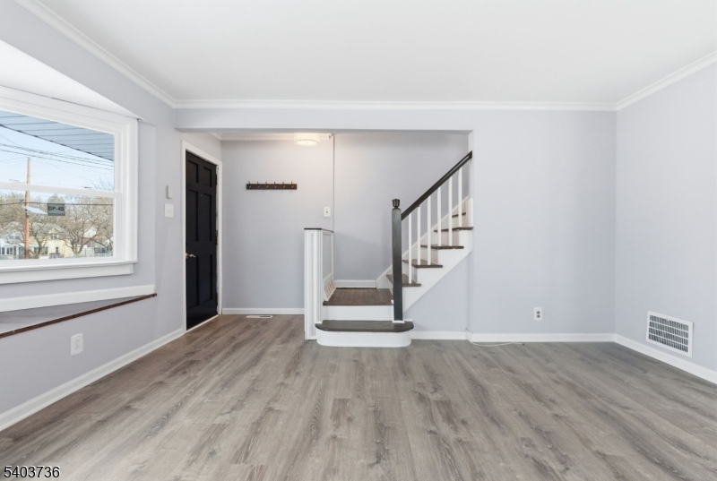 43 Freeman Street Woodbridge, NJ 07095 - Photo 6 of 24 a view of an entryway with wooden floor and door