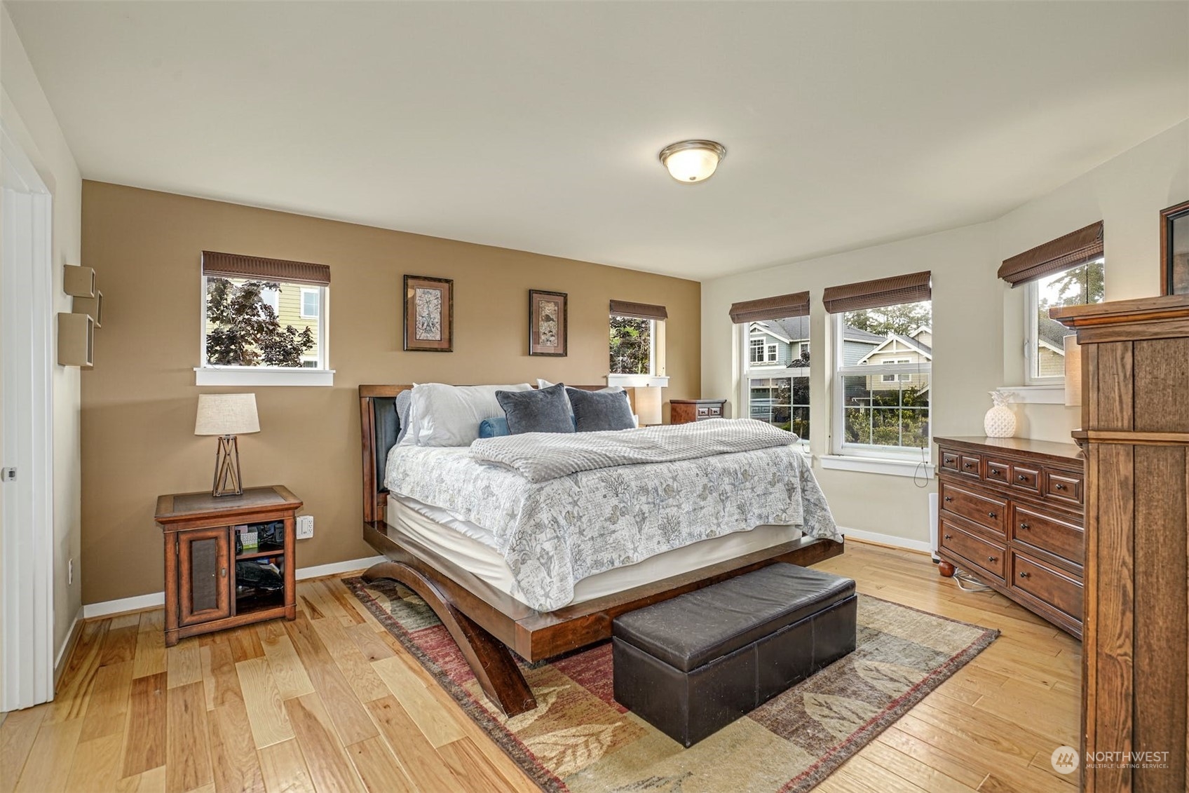4029 180th Place Southeast Bothell, WA 98012 - Photo 19 of 33 a bedroom with a bed and wooden floor