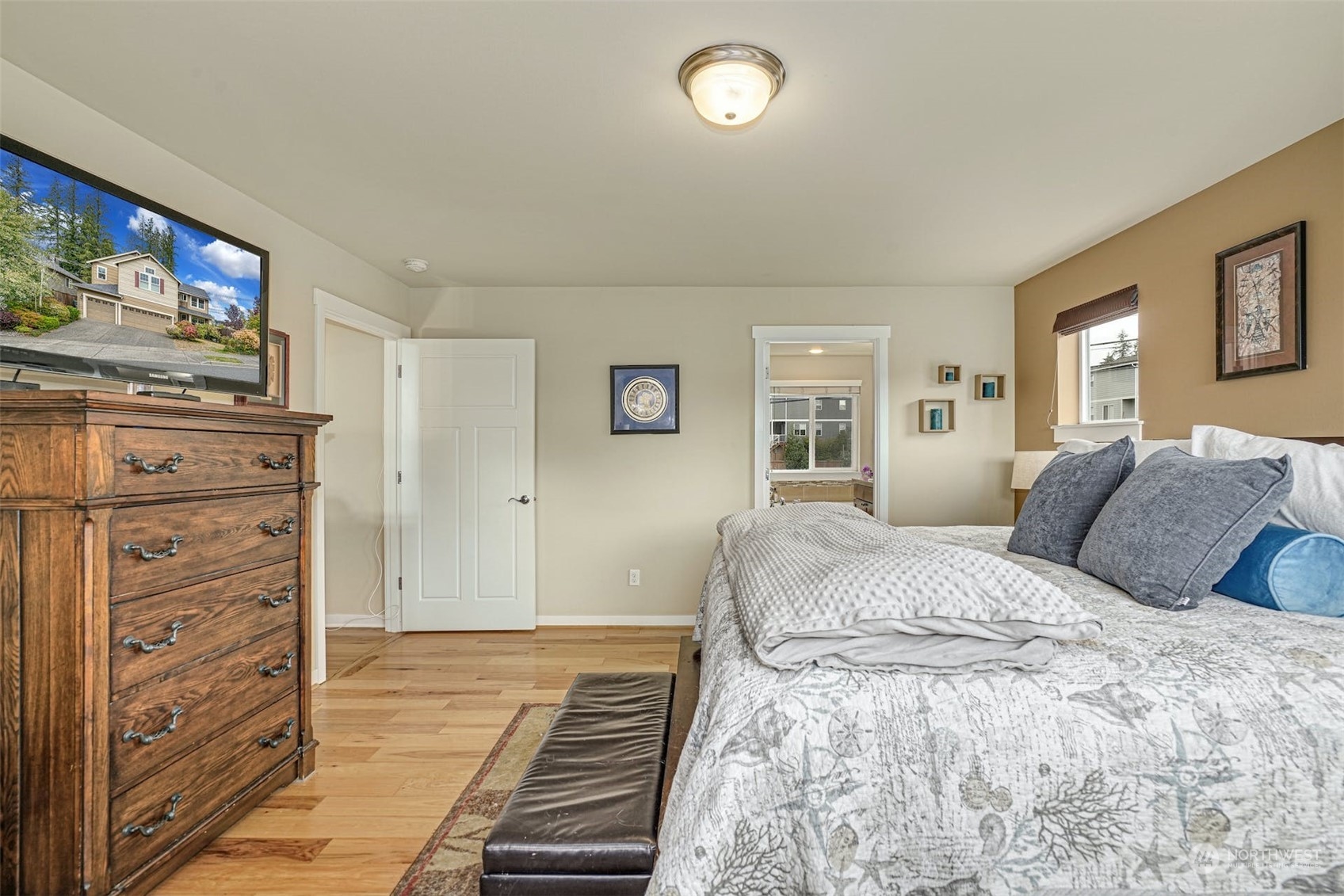 4029 180th Place Southeast Bothell, WA 98012 - Photo 20 of 33 a bedroom with a bed and a flat screen tv