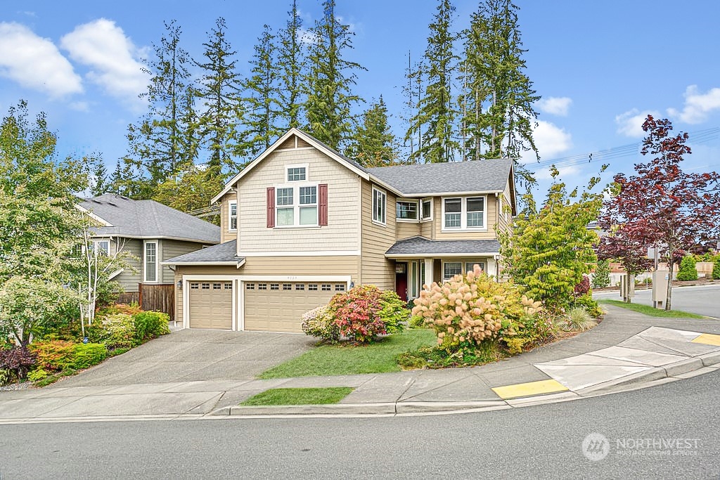 4029 180th Place Southeast Bothell, WA 98012 - Photo 2 of 33 a front view of a house with a garden