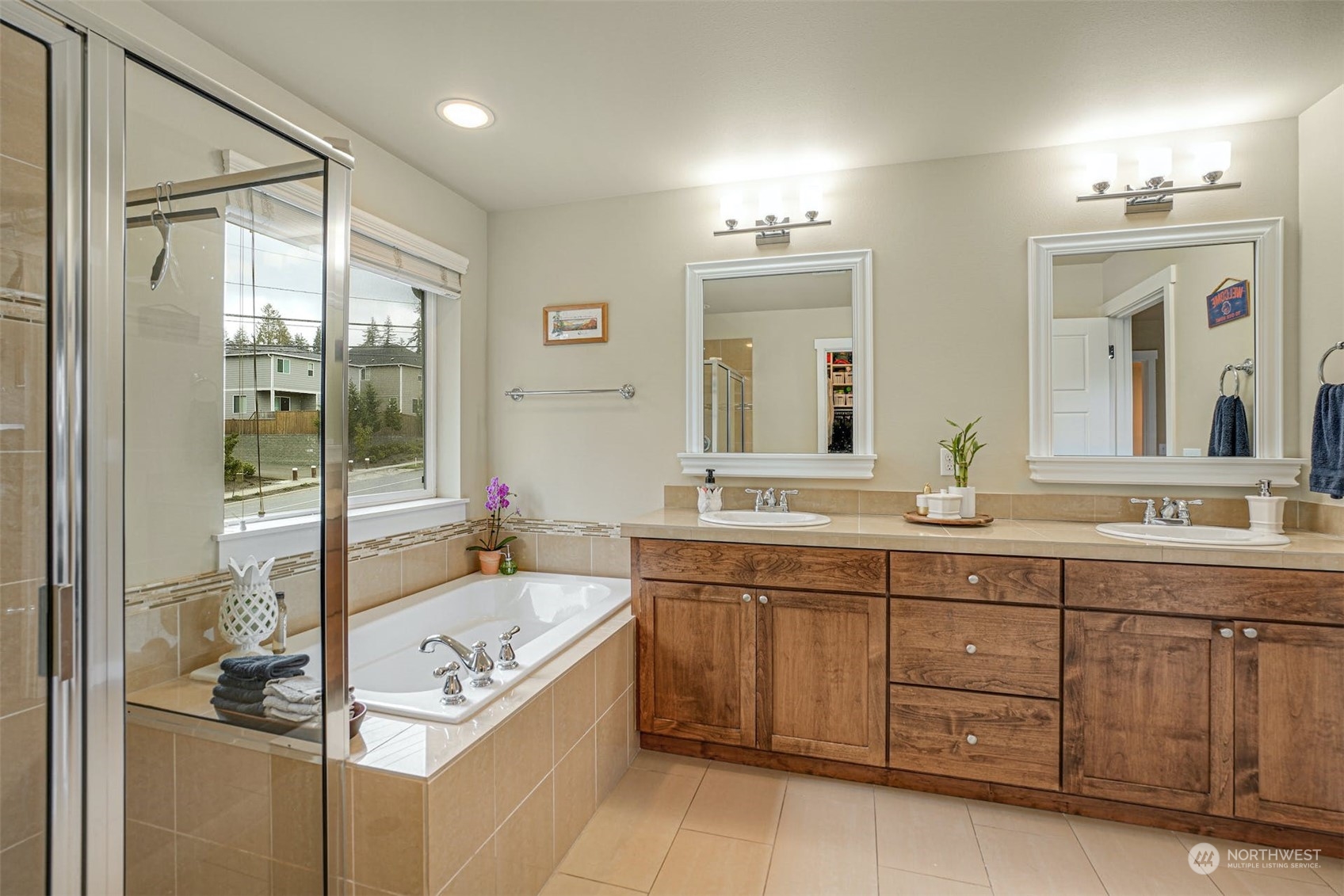 4029 180th Place Southeast Bothell, WA 98012 - Photo 23 of 33 a bathroom with a tub sink and mirror