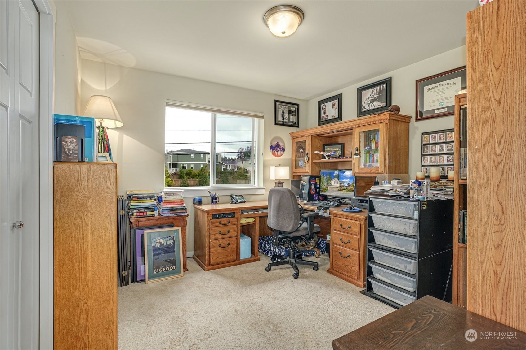 4029 180th Place Southeast Bothell, WA 98012 - Photo 26 of 33 a view of a workspace with furniture and a window