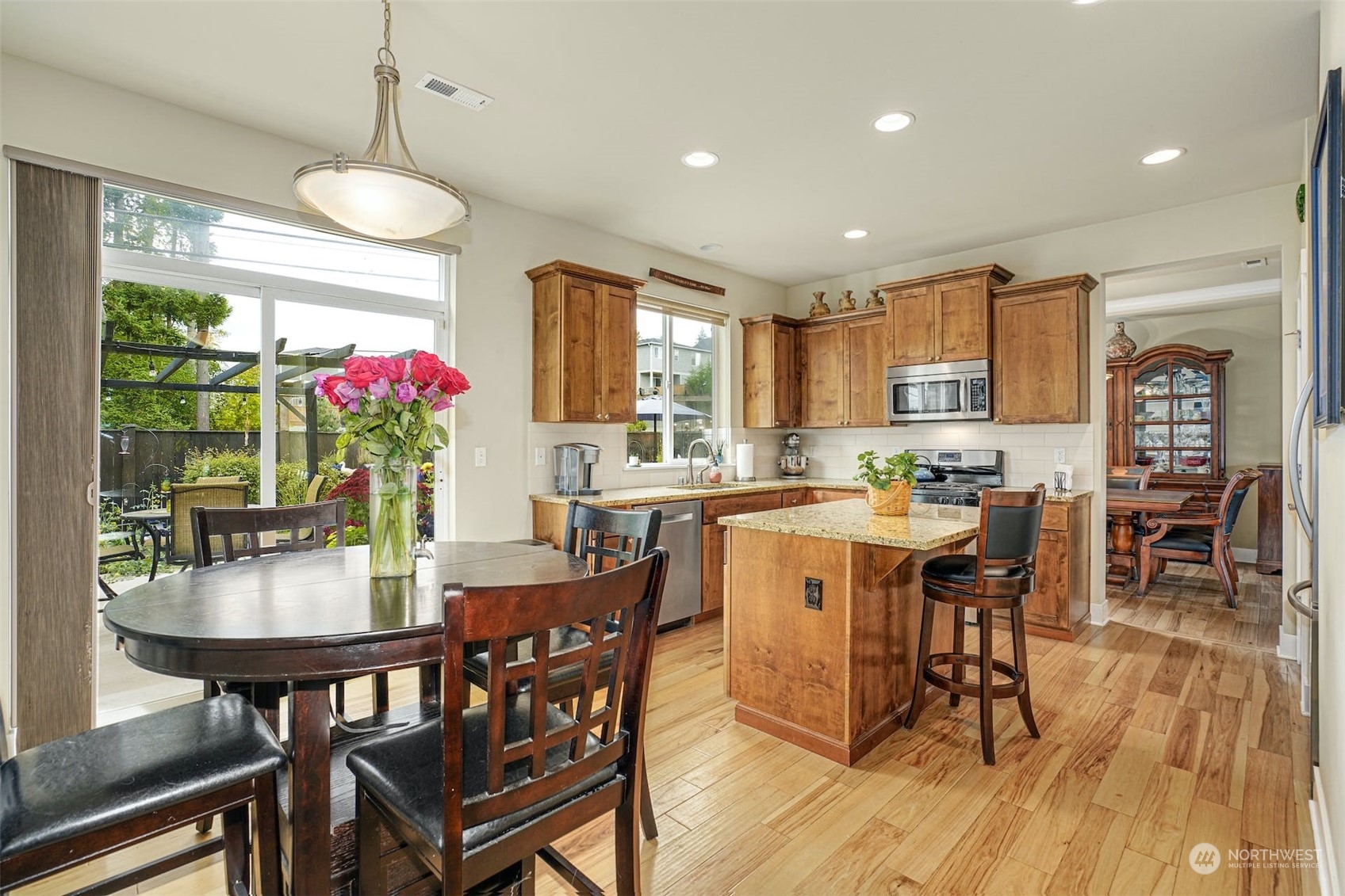 4029 180th Place Southeast Bothell, WA 98012 - Photo 10 of 33 a view of a dining room with furniture window and wooden floor