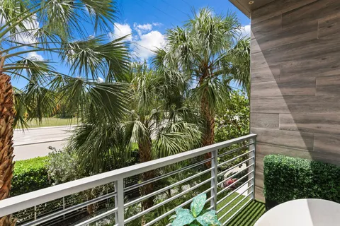 a bed room with a bed and a large window