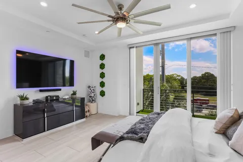 a view of balcony with wooden floor