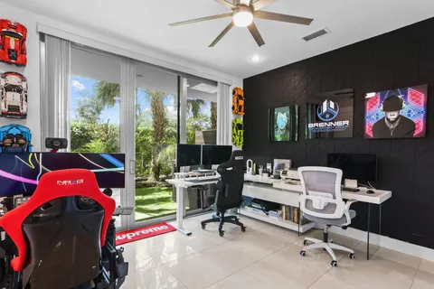 a bathroom with a toilet and a potted plant
