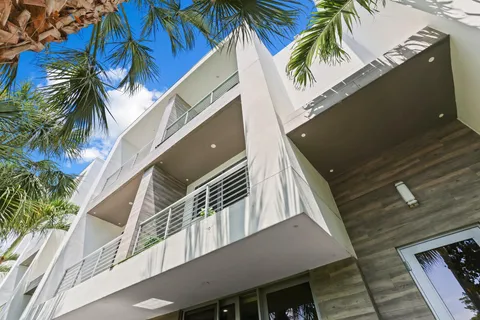 a view of a chairs and table in patio