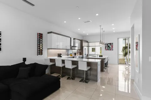 a kitchen with a sink a stove and cabinets