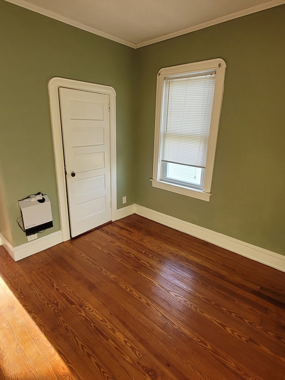 303 Cambridge Street, Unit 3 Fall River, MA 02721 - Photo 4 of 9 a view of a room that has a bed and a window