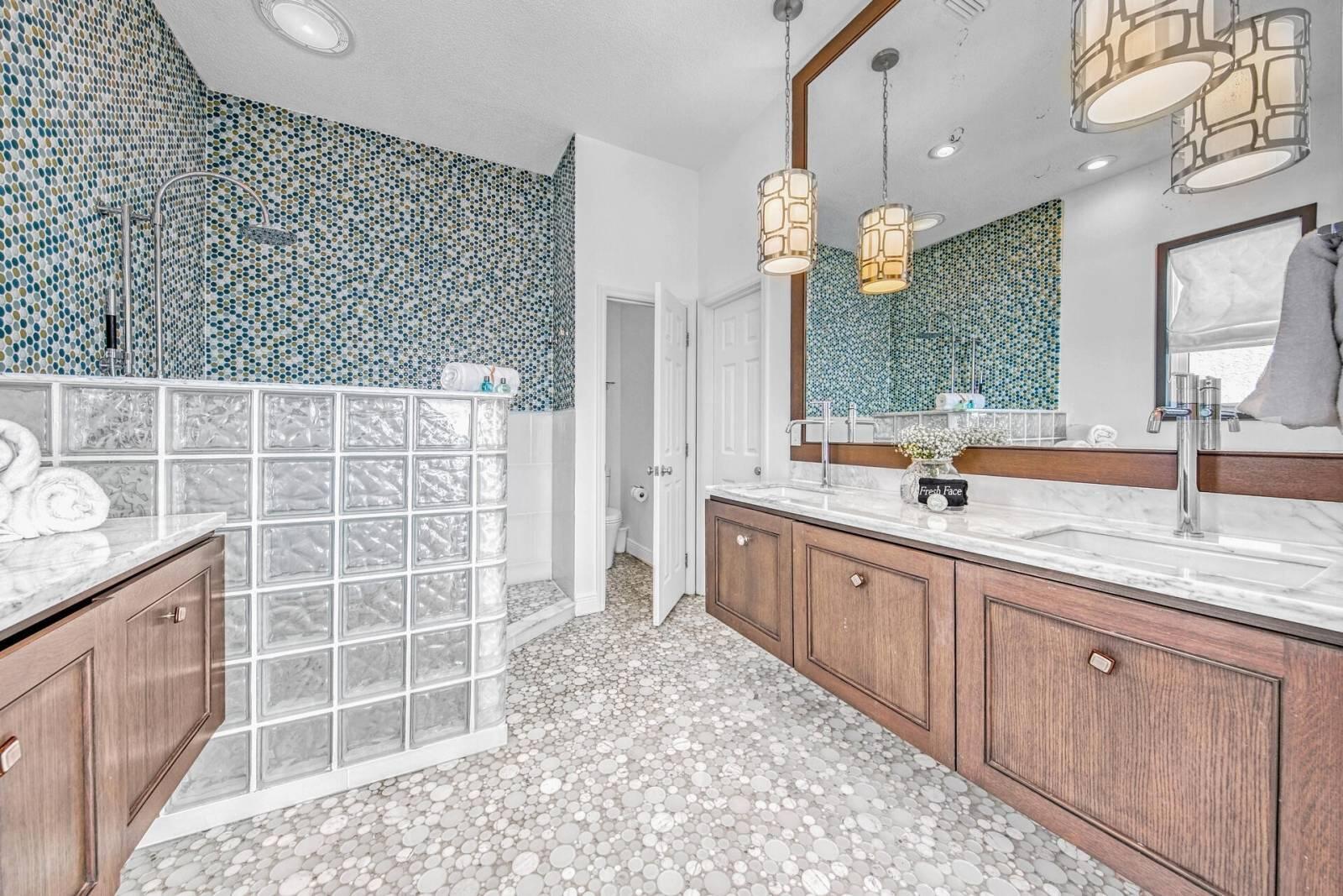 8034 East County Highway Inlet Beach, FL 32461 - Photo 5 of 5 a large bathroom with a sink a large mirror and a light fixture