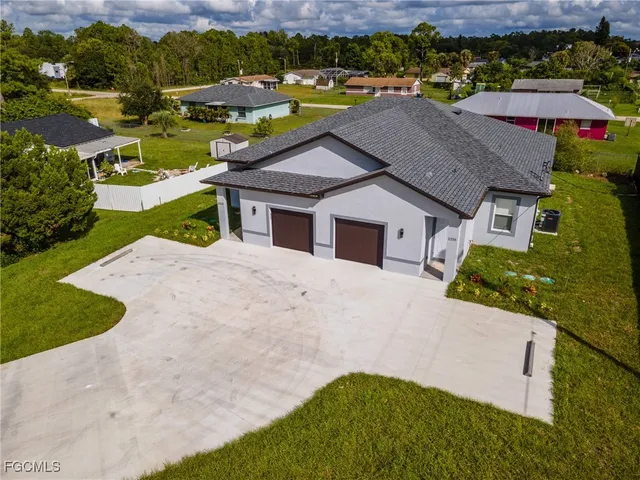 an aerial view of house with yard