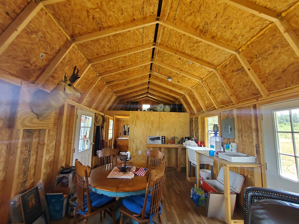 375 Hillside Road, Unit 20 Fort McKavett, TX 76841 - Photo 10 of 15 a view of a dining room with furniture window and outside view
