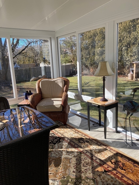 17 Brookside Drive Acushnet, MA 02743 - Photo 27 of 41 a living room with furniture and a floor to ceiling window