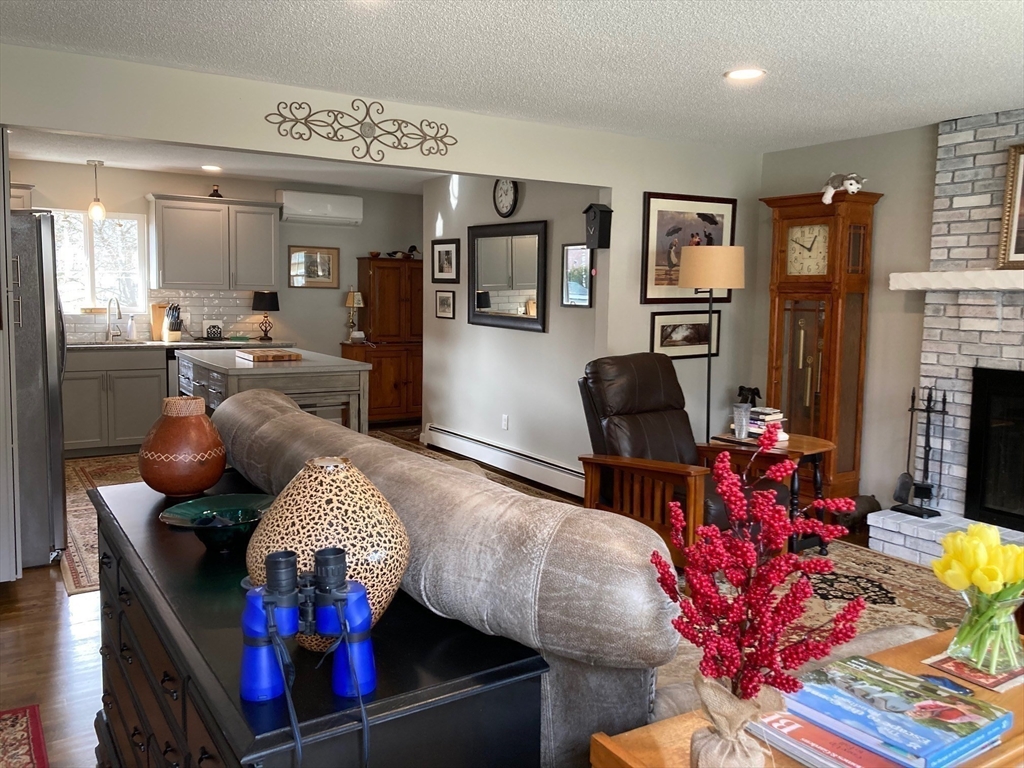 17 Brookside Drive Acushnet, MA 02743 - Photo 7 of 41 a living room with furniture fireplace and dining room