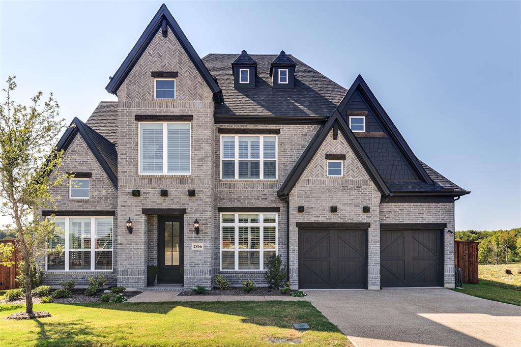 2866 Shane Drive Midlothian, TX 76065 - Photo 1 of 40 a front view of a house with large windows