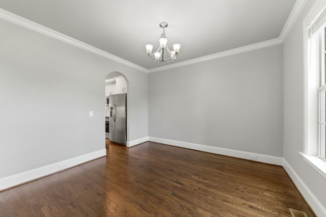 a view of an entryway with wooden floor and windows