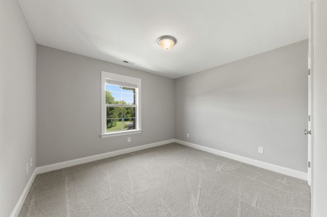 a view of a room with wooden floor and sink