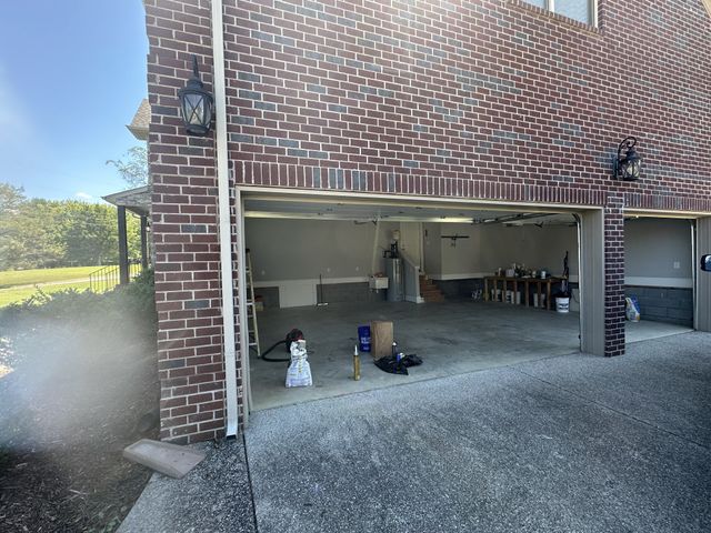 an aerial view of residential house with outdoor space and swimming pool