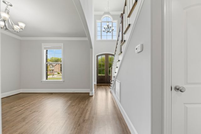 a view of gallery with wooden floor