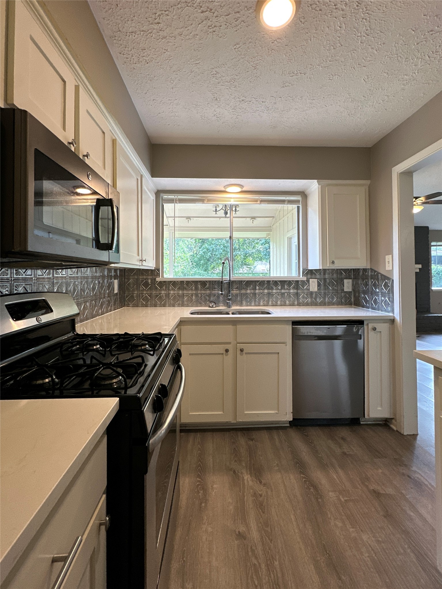 26403 Hunters Hollow Drive Spring, TX 77380 - Photo 8 of 34 Kitchen window leads to outdoor patio!