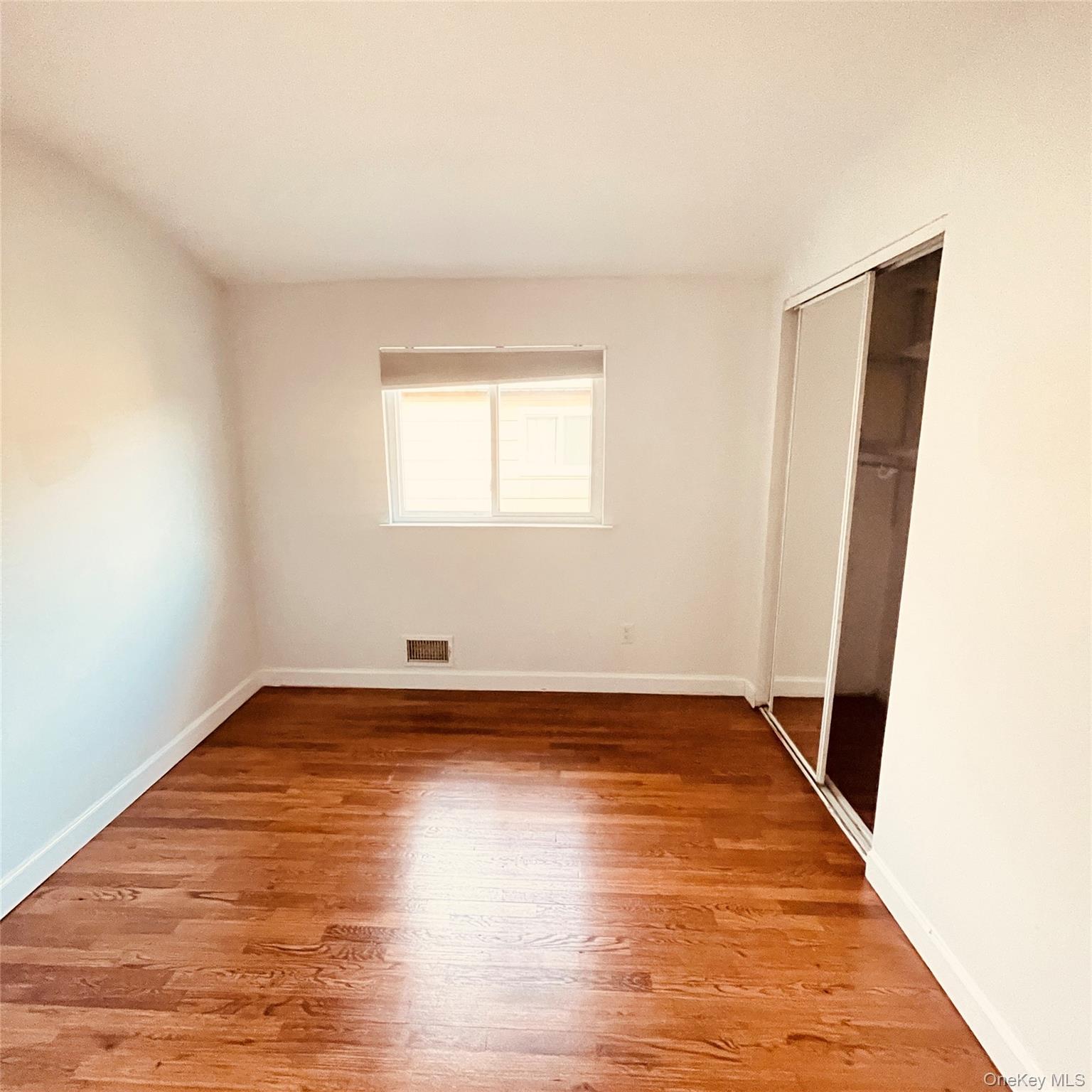878 Rensselaer Avenue Staten Island, NY 10309 - Photo 11 of 35 Unfurnished bedroom featuring light wood-style floors and a closet