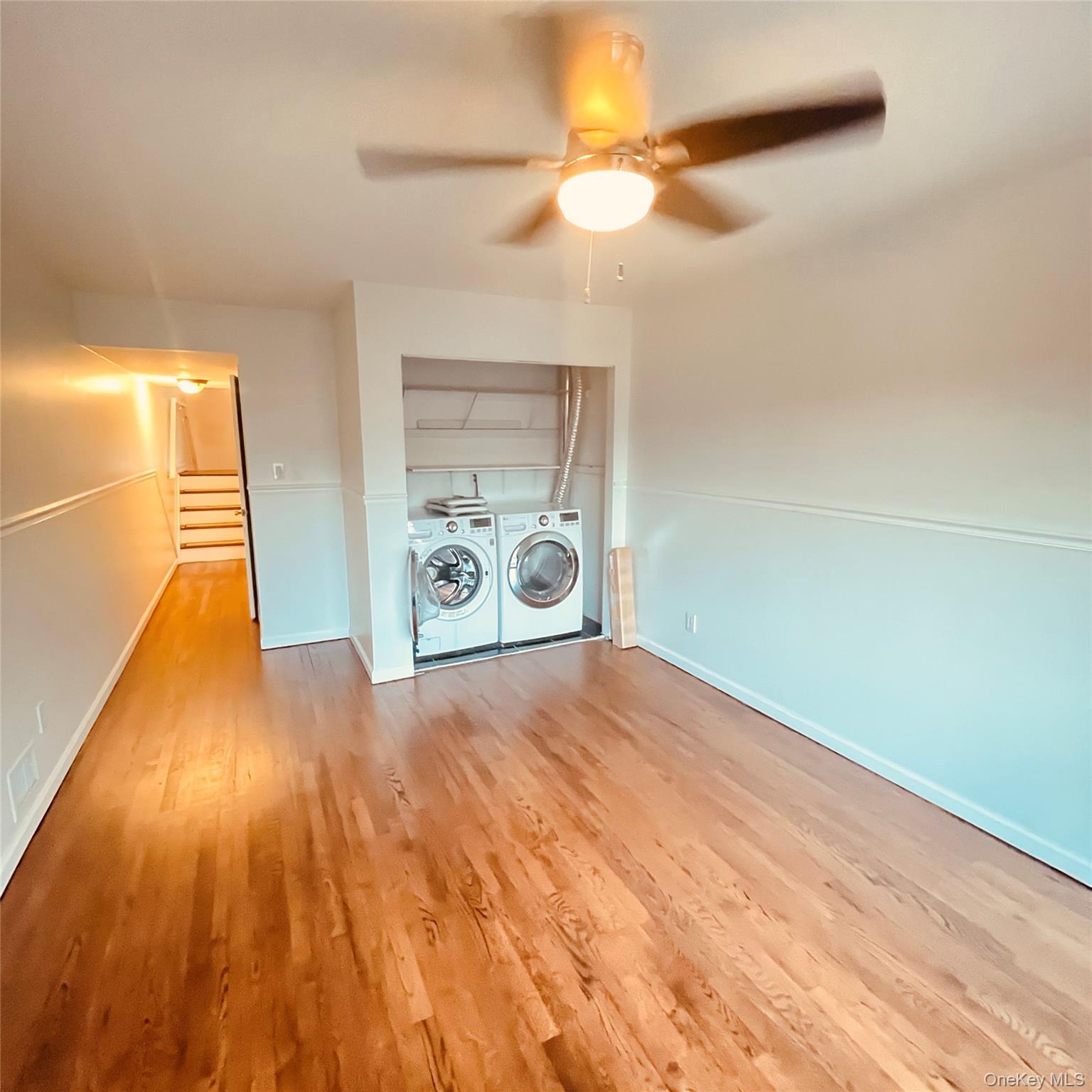 878 Rensselaer Avenue Staten Island, NY 10309 - Photo 16 of 35 Laundry area with light wood-type flooring, washer and dryer, and a ceiling fan