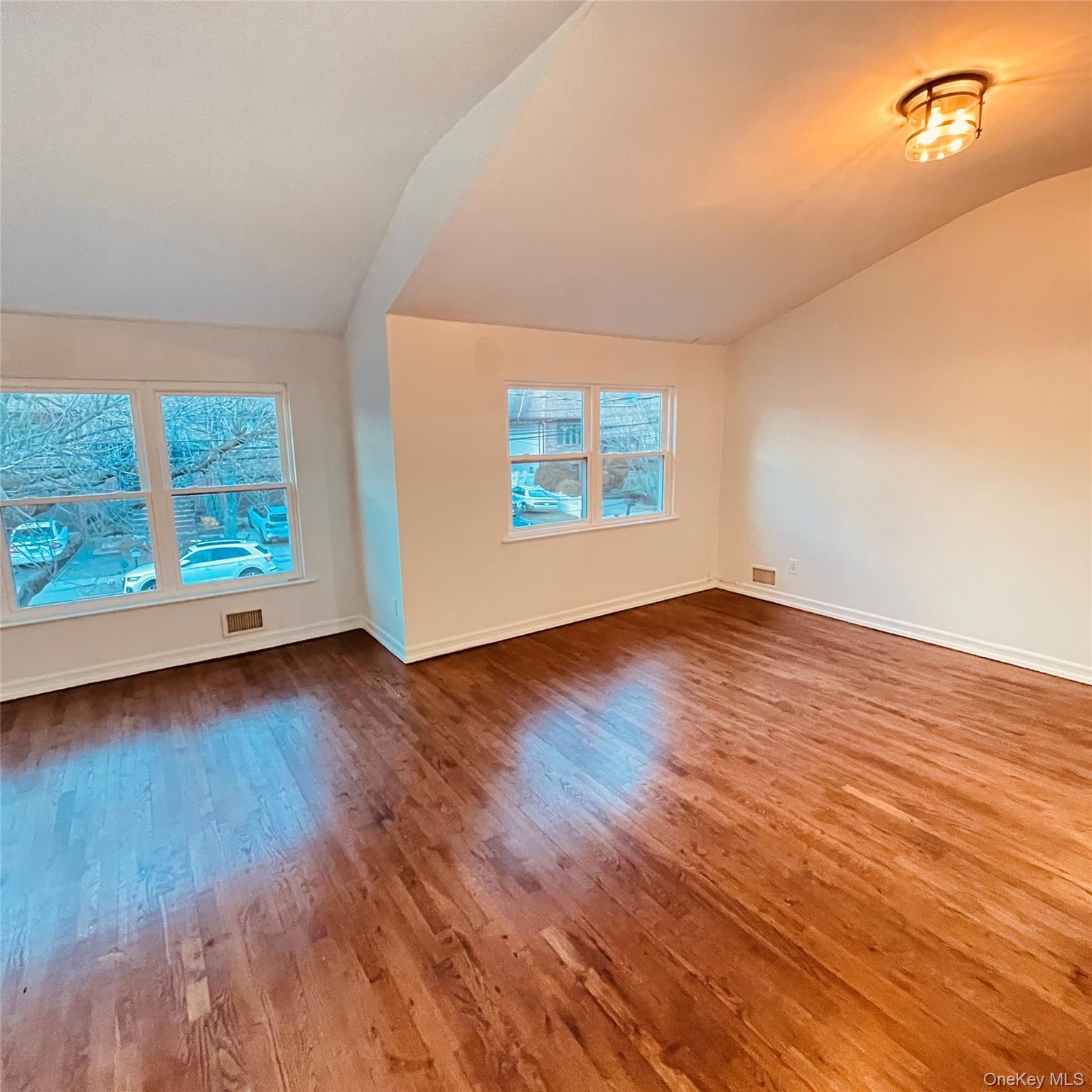 878 Rensselaer Avenue Staten Island, NY 10309 - Photo 22 of 35 Unfurnished room featuring lofted ceiling and wood-type flooring