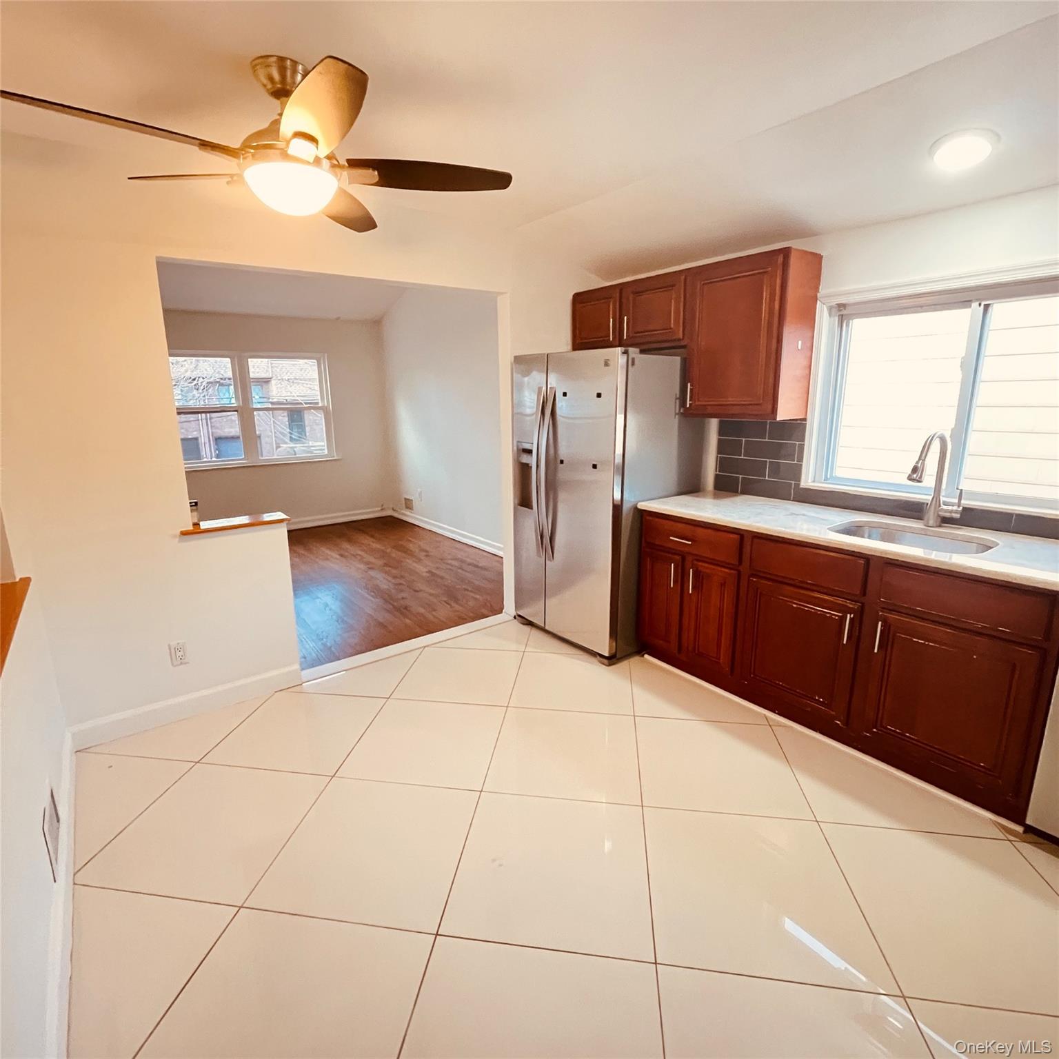 878 Rensselaer Avenue Staten Island, NY 10309 - Photo 5 of 35 Kitchen with tasteful backsplash, stainless steel fridge with ice dispenser, a ceiling fan, and healthy amount of natural light
