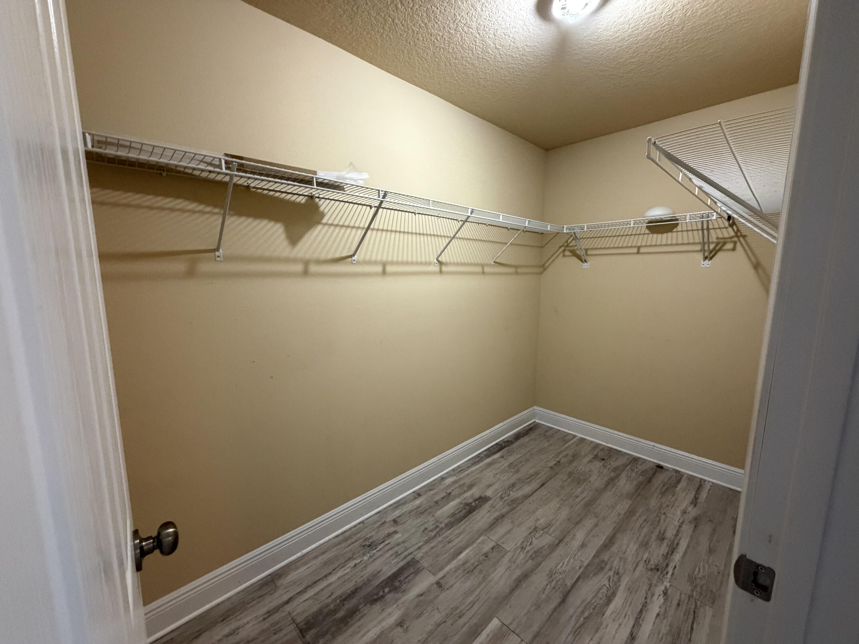 114 Rearden Way Santa Rosa Beach, FL 32459 - Photo 14 of 25 a view of a room with racks on the wall