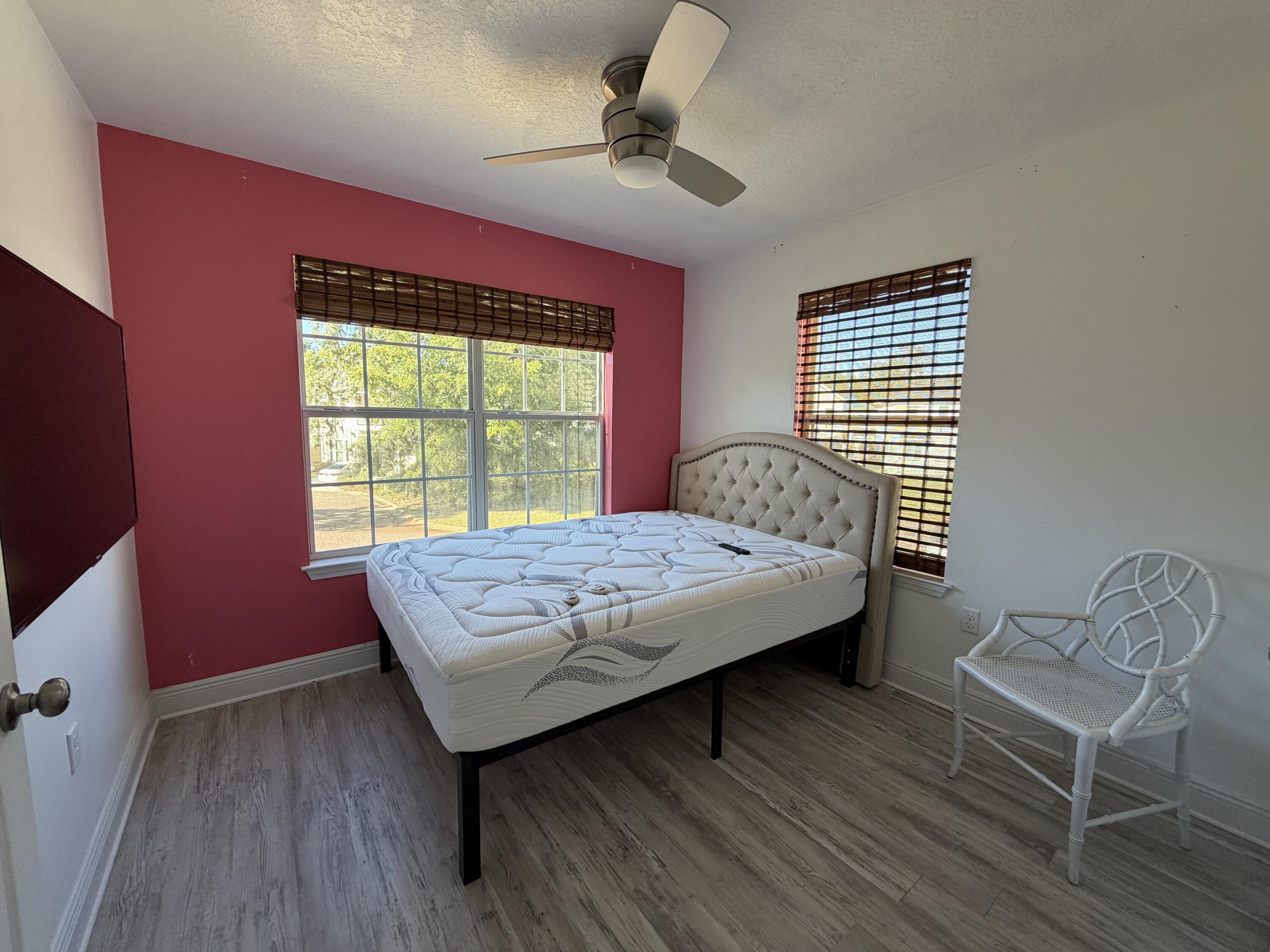 114 Rearden Way Santa Rosa Beach, FL 32459 - Photo 20 of 25 a bed sitting in a bedroom next to a window
