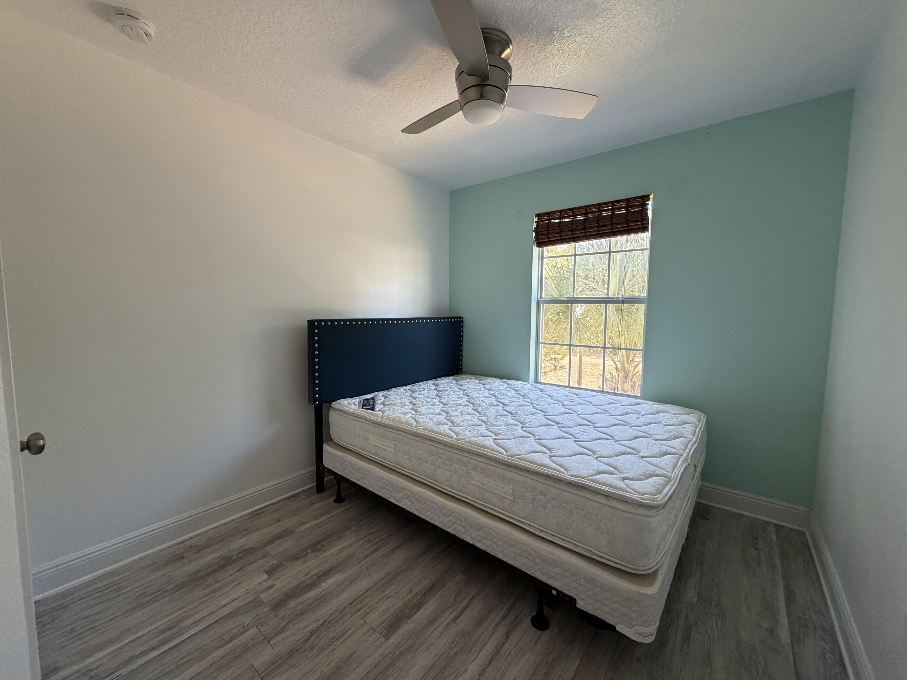 114 Rearden Way Santa Rosa Beach, FL 32459 - Photo 21 of 25 a bedroom with a bed and window