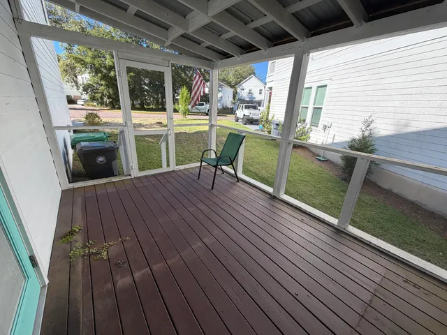a view of a chairs and table on the balcony