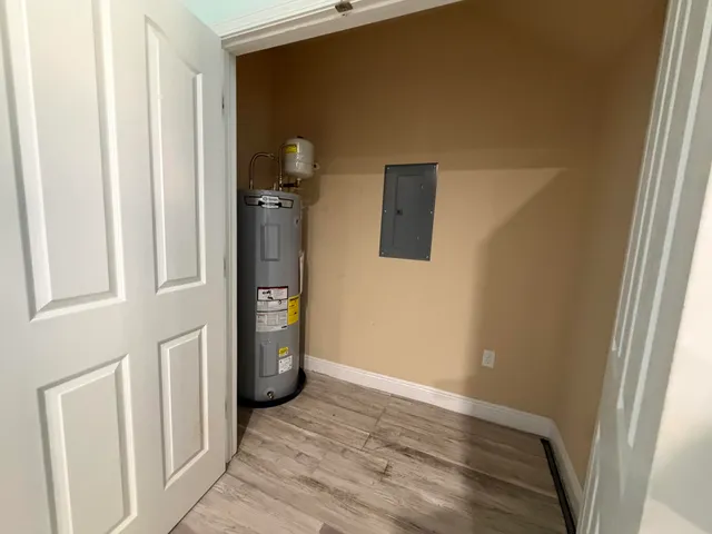 a view of an entryway with wooden floor