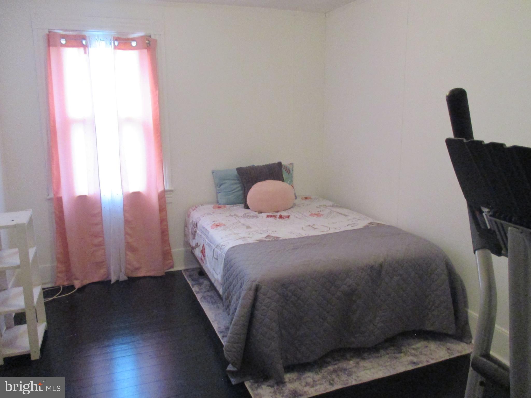 333 Pratt Street Luke, MD 21540 - Photo 26 of 42 a bedroom with a bed and wooden floor