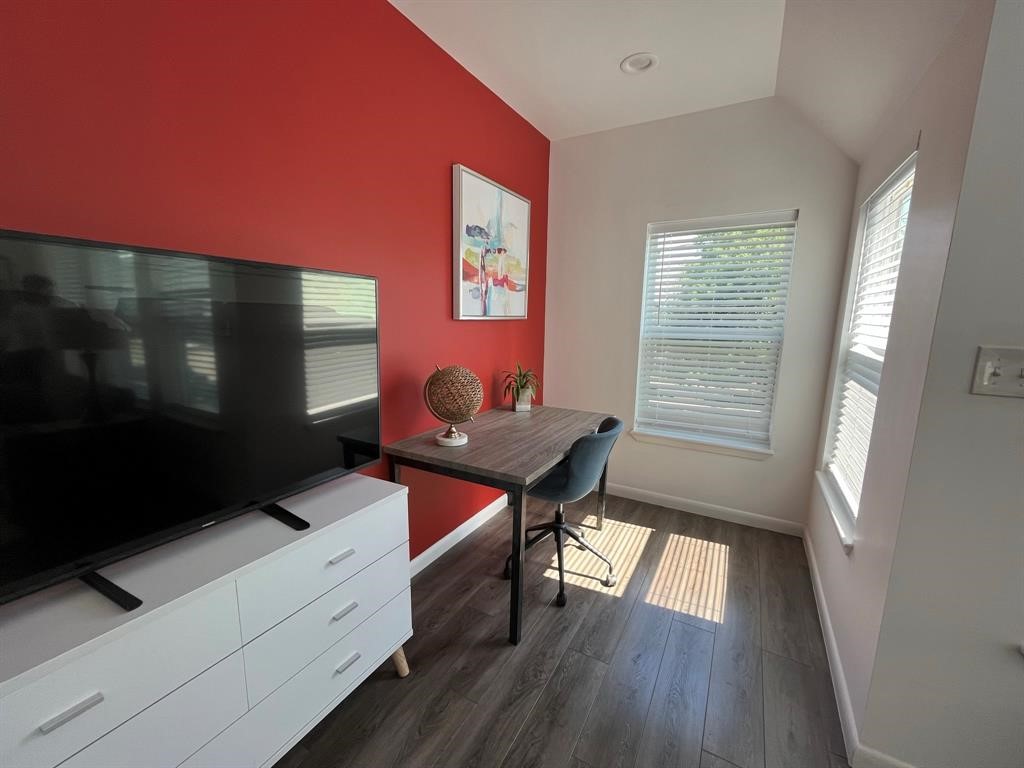 1920 Calumet Street, Unit 202 Houston, TX 77004 - Photo 4 of 7 a room with furniture and window