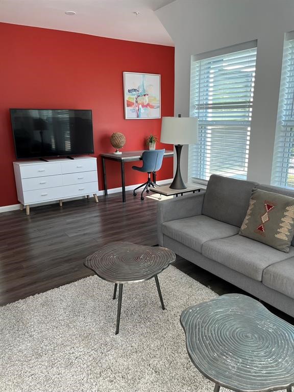 1920 Calumet Street, Unit 202 Houston, TX 77004 - Photo 5 of 7 a living room with furniture and a fireplace